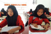 SMAN 5 BS Menggalakkan Program Basmi Buta Baca Al-Qur'an